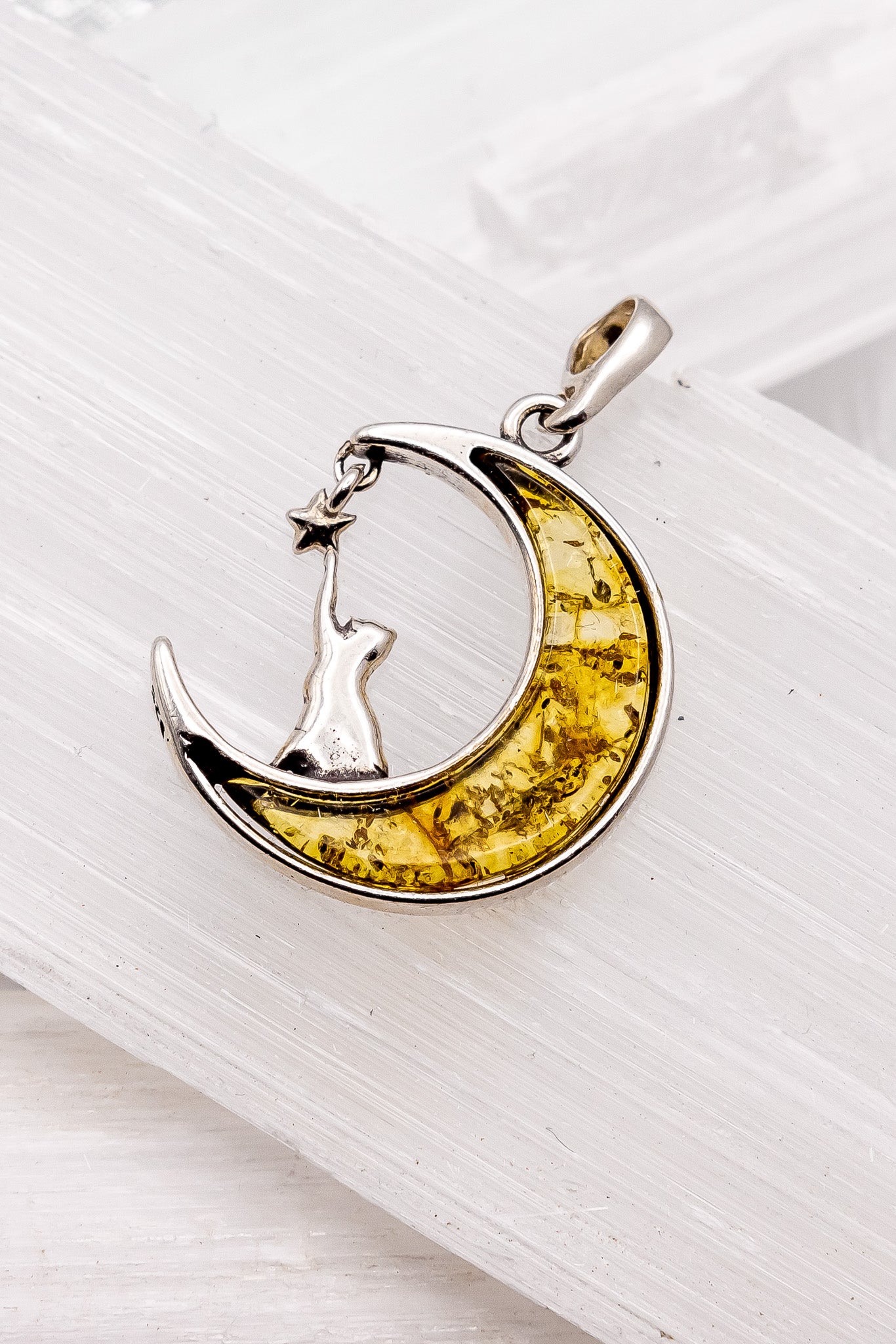 Cat Pawing at Star Amber Pendant