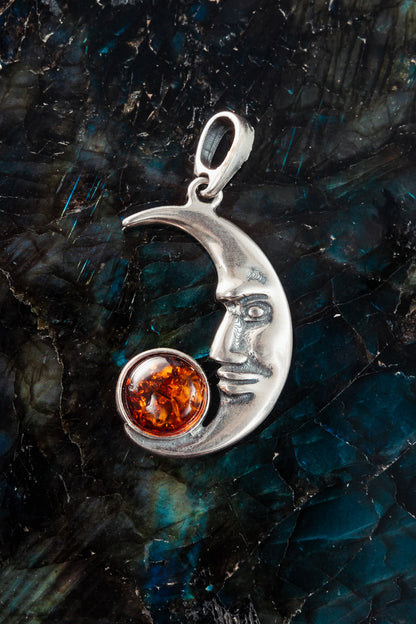 Cherry Amber Crescent Moon Face Pendant