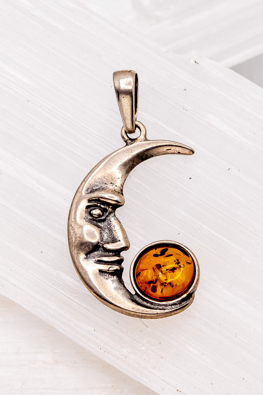 Cherry Amber Crescent Moon Face Pendant