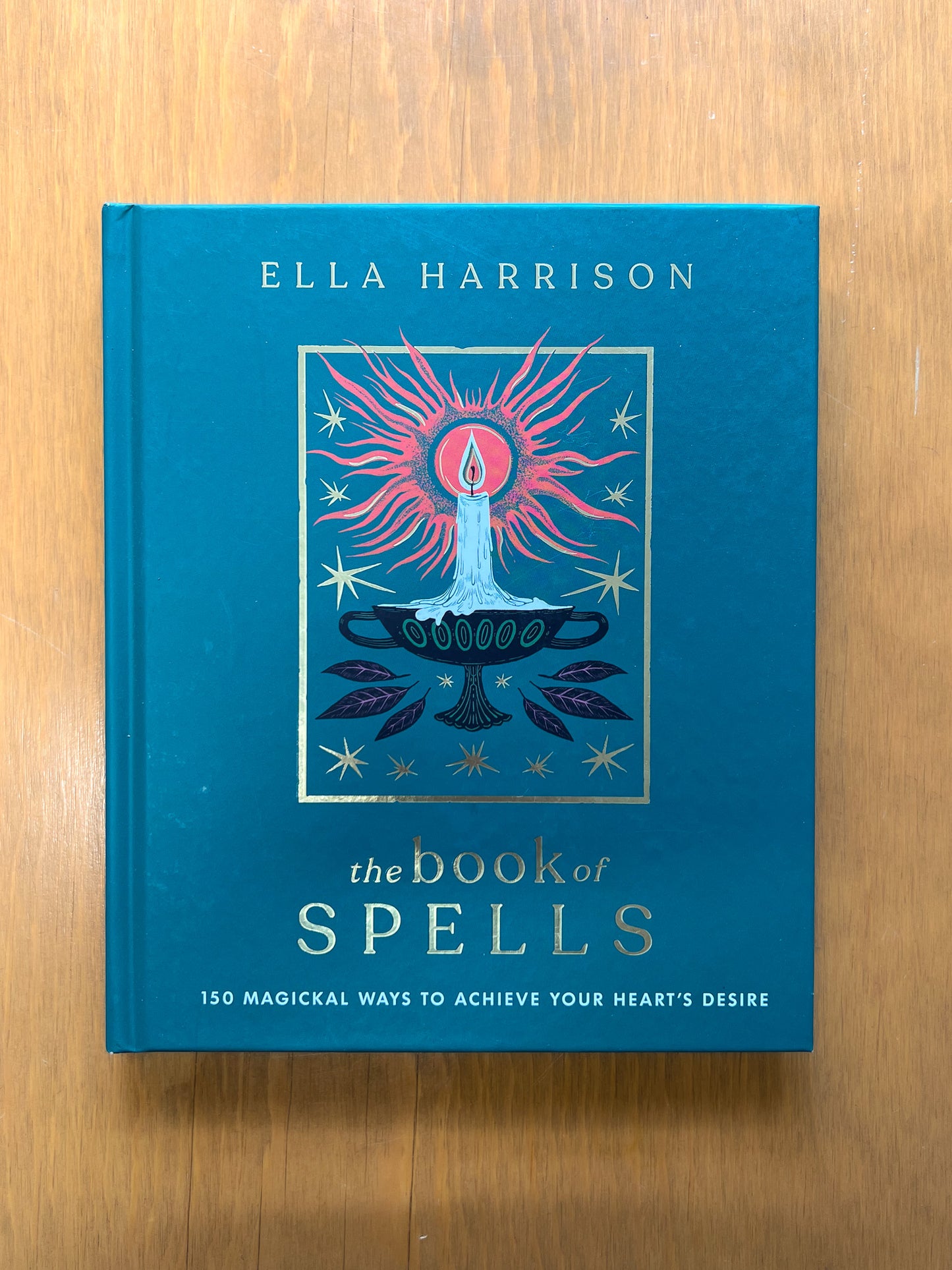 The Book of Spells: 150 Magickal Ways to Achieve Your Heart's Desire by Ella Harrison